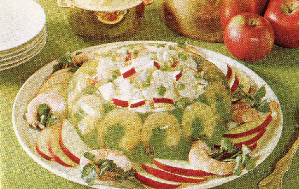 A weird 1970s jello-mold ring with shrimp and apples in it.